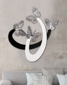 Show details for Grande orologio da parete farfalle avorio nero design moderno Picture of Grande orologio da parete farfalle avorio nero design moderno