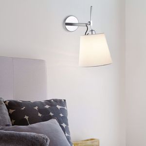 Classic wall light above bedside table rotating white lampshade